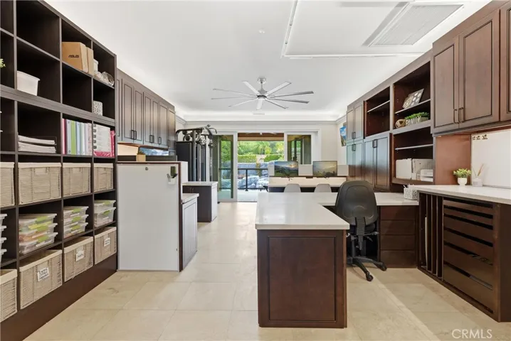 Large office with built in storage and craft table