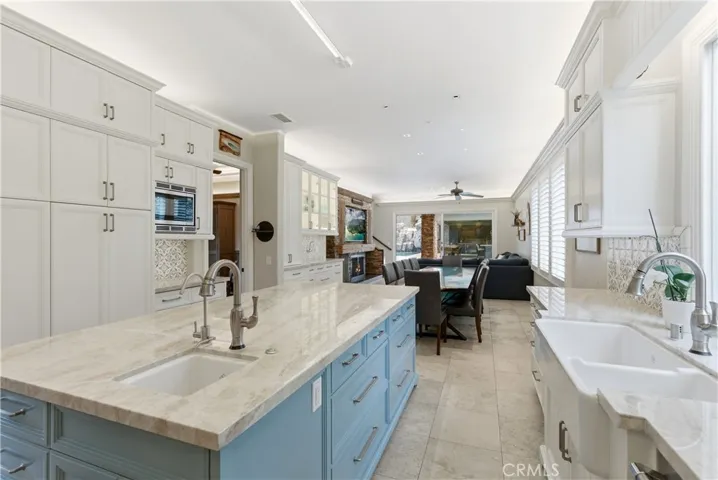 View of open concept kitchen to dining and family room