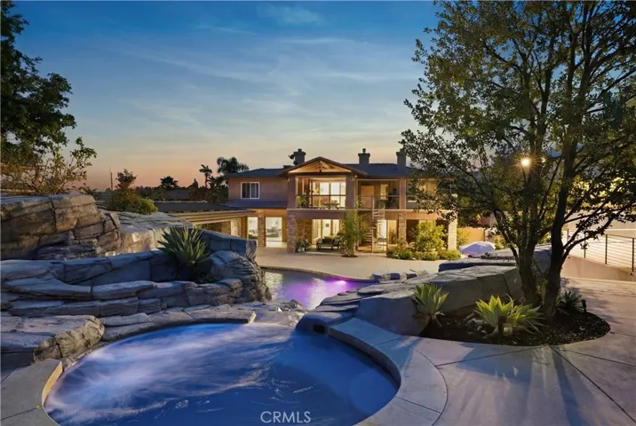 View from hot tub overlooking backyard to home.