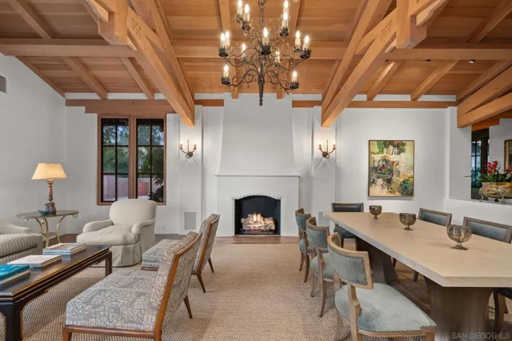 Grand entertaining living room and dining area with adjacent wet bar and outdoor space to enjoy drinks before dinner.