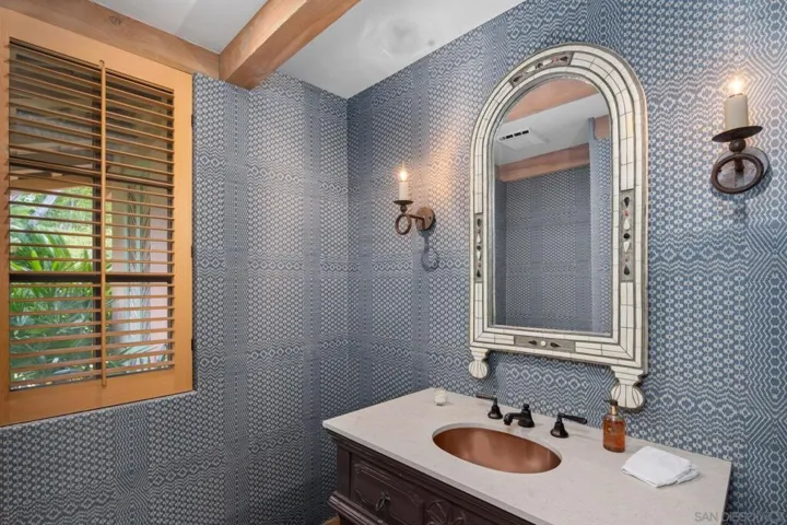 Stunning Brunschwigfils cloth wallpaper graces wall behind master bed and seamless adds to the uplifting decor.