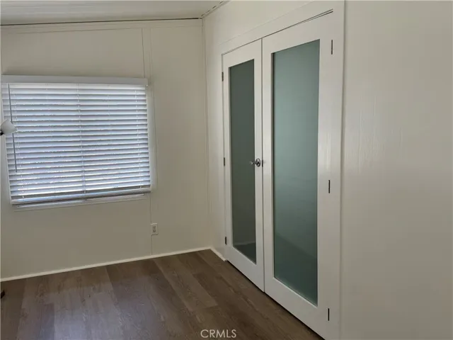New glass French Doors from Sunroom to family room