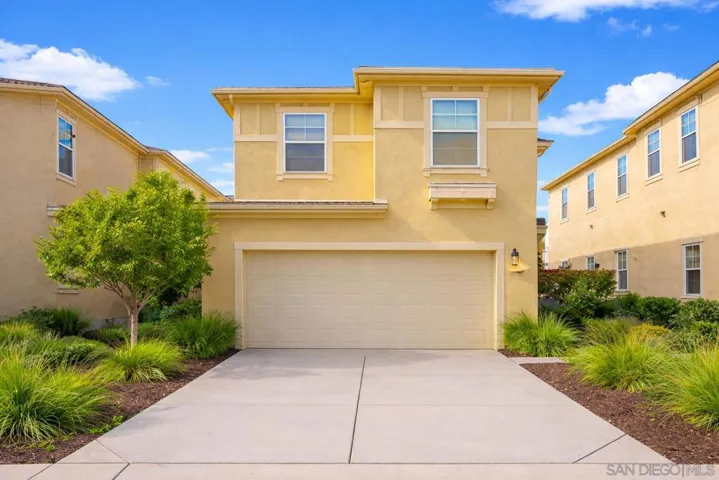 Great curb appeal and full 2 car garage for vehicles and storage. HOA takes care of the landscaping.