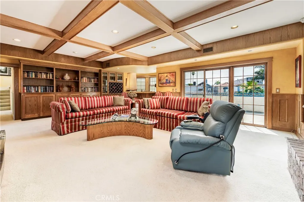 Has boxed ceilings and built-in bookcases