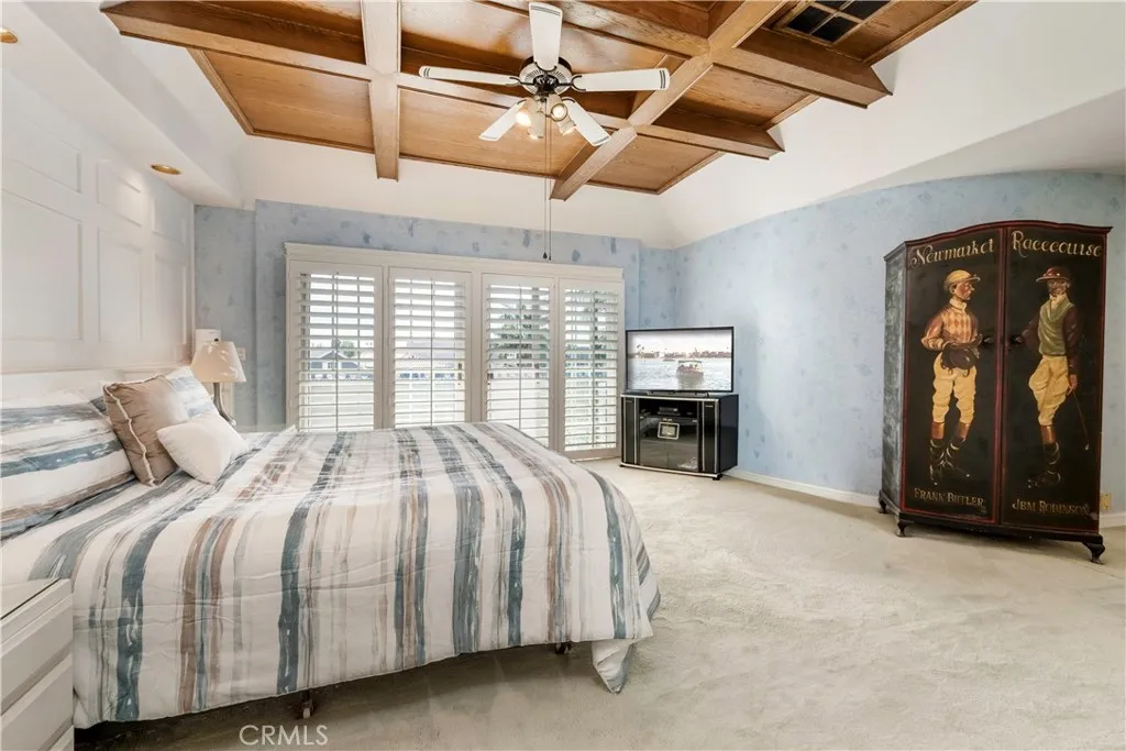Primary bedroom with boxed ceilings