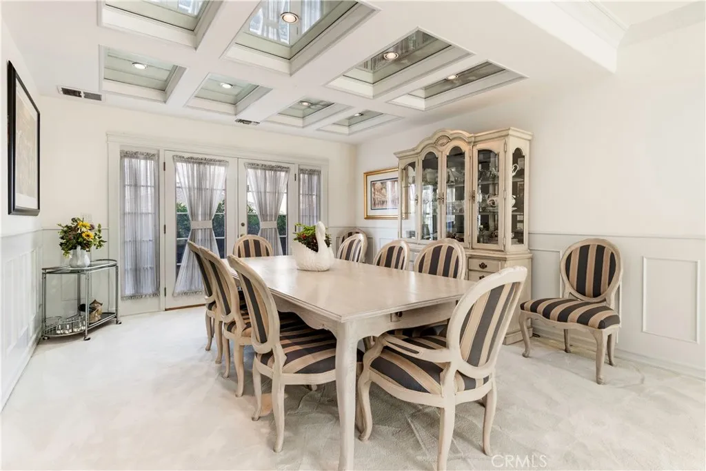 Formal dining room with boxed ceilings