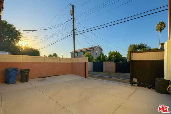 Back yard/gated 3-car driveway