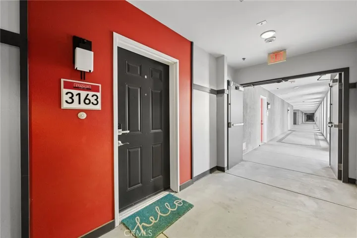 The elevator is on the right at the end of this covered but open air walkway.