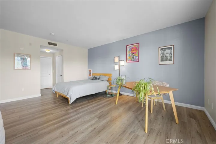 Just past the bed is a walk-in closet and laundry space.