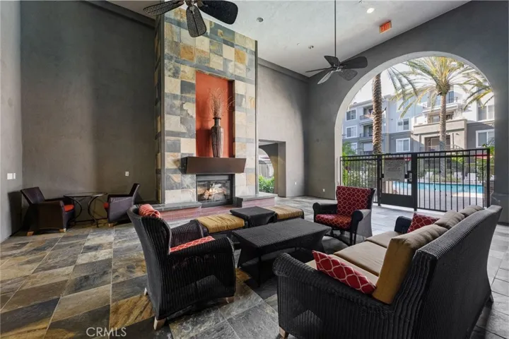 Covered outdoor fireplace adjacent to the pool.