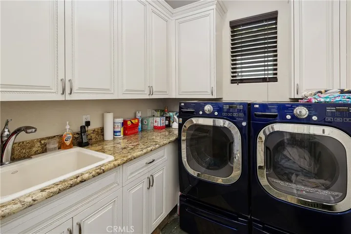 Huge laundry room with sink.