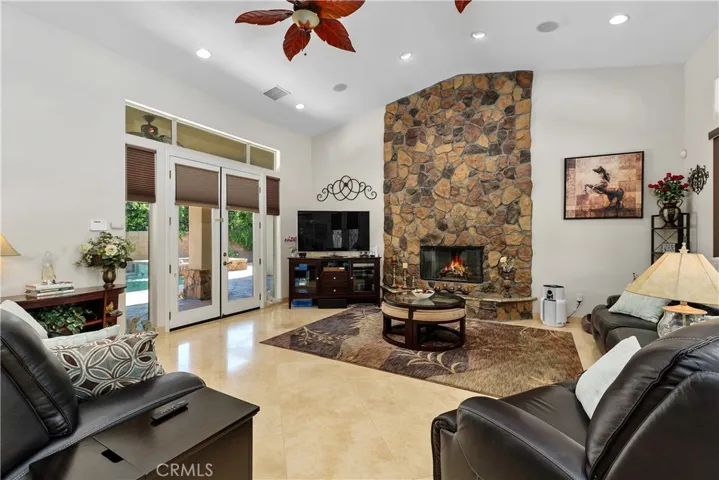 Large open living area with vaulted ceiling.