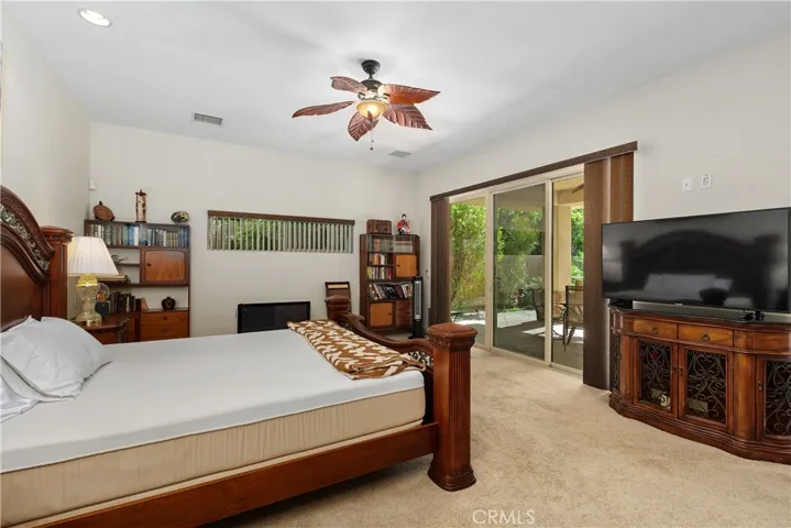 Main bedroom leading to covered porch.