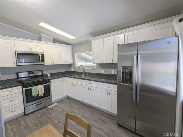 REMODELED Kitchen with Stainless steel appliances.  BRAND NEW Refrigerator with ICE MAKER!