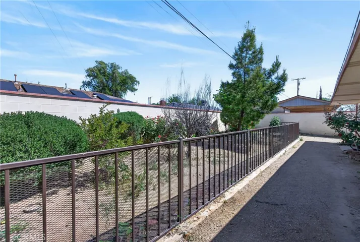 rear yard with a fence for plants