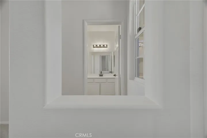 Entrance to downstairs full bathroom & bedroom.