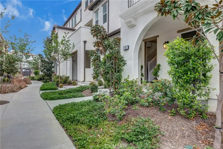 Lush green walkway leading to your next home
