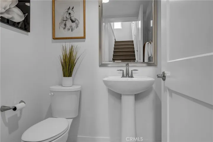 Powder room conveniently tucked  under the staircase