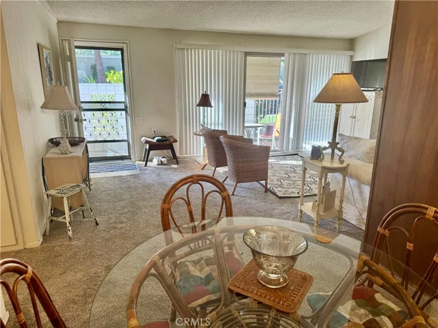 Dining Are with View of Front Door Entry and Living Room.