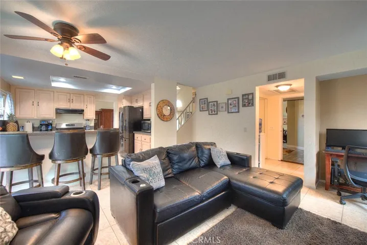 Family room facing kitchen and entry to bonus room
