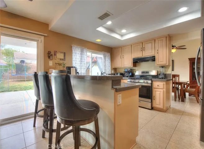 Kitchen facing rear exit and entry to dining room