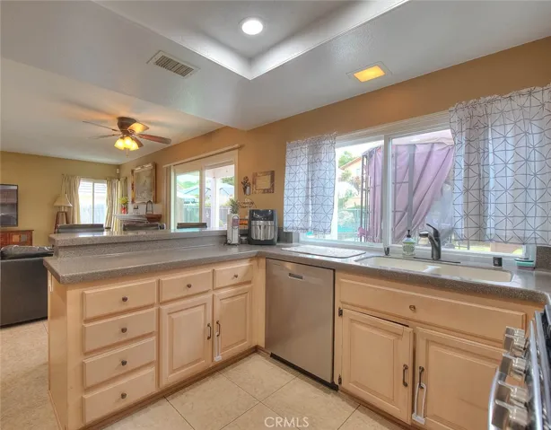 Kitchen facing family room and rear exit