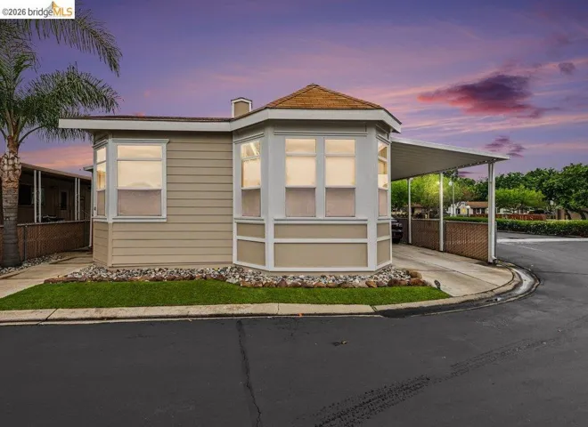 View of front of property featuring a carport