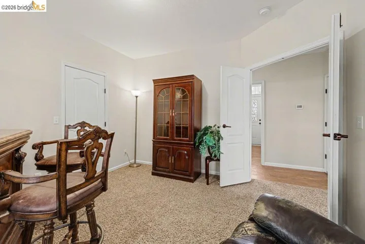 Office featuring light colored carpet and baseboards