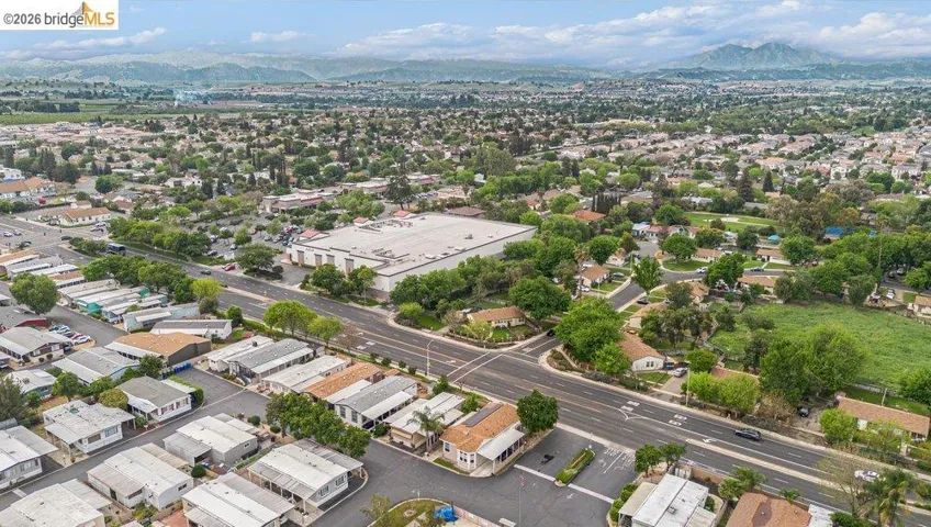 Aerial perspective of suburban area featuring a mountainous background