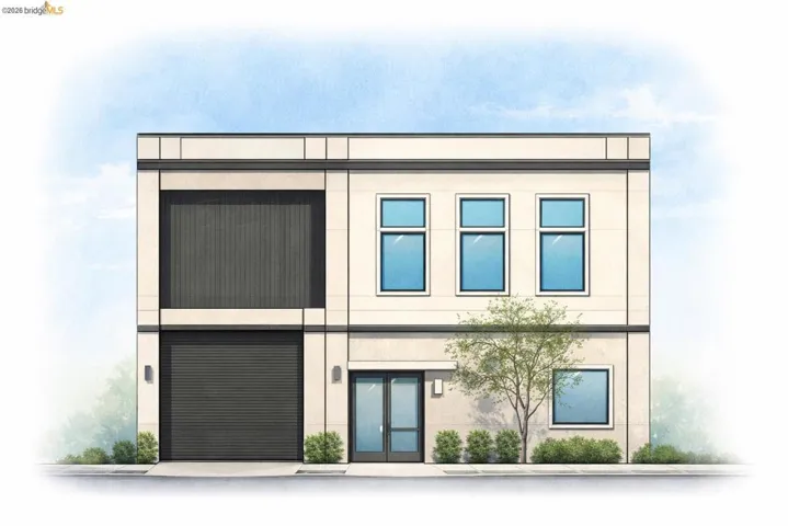View of front facade featuring a garage and stucco siding