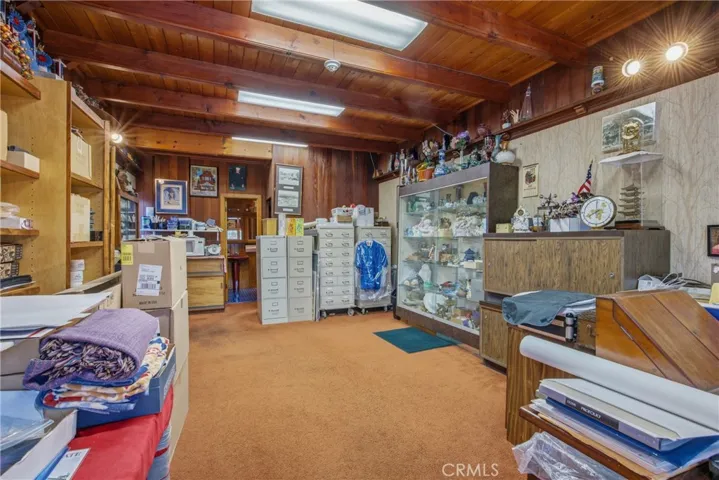 Warm wood-beamed interiors with creative workspace potential