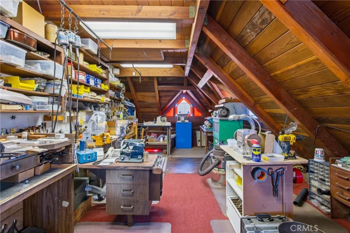 Additional loft space with built-in storage and display options