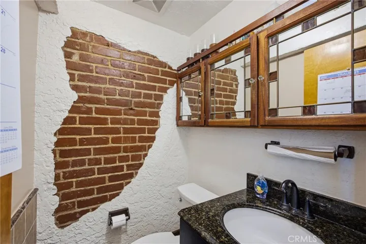 Historic brick detail with ground-level restroom