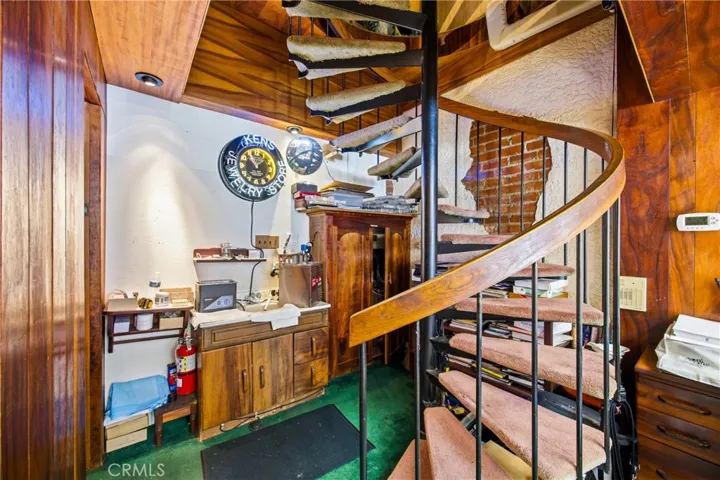 Interior staircase connecting multiple functional levels