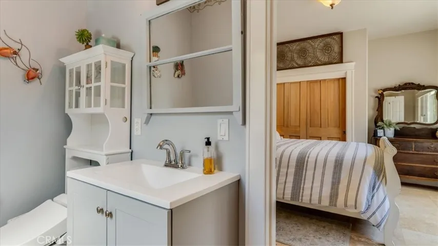 Indoor/outdoor Bathroom for bed 6 and people in the backyard