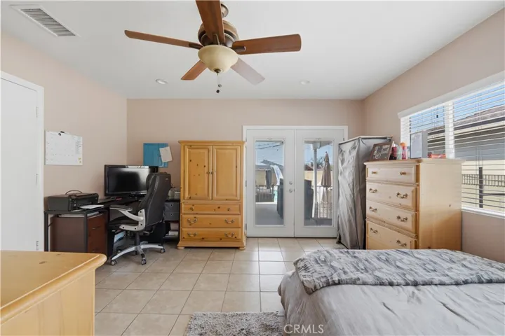 Office with french door access to patio and pool area