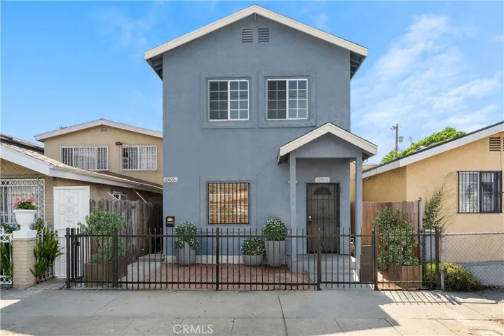 Front Exterior – Virtually Staged; landscaping shown is digital enhancement only
