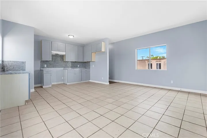 Upper Kitchen has New Cabinets, Backsplash, Faucet & Lighting