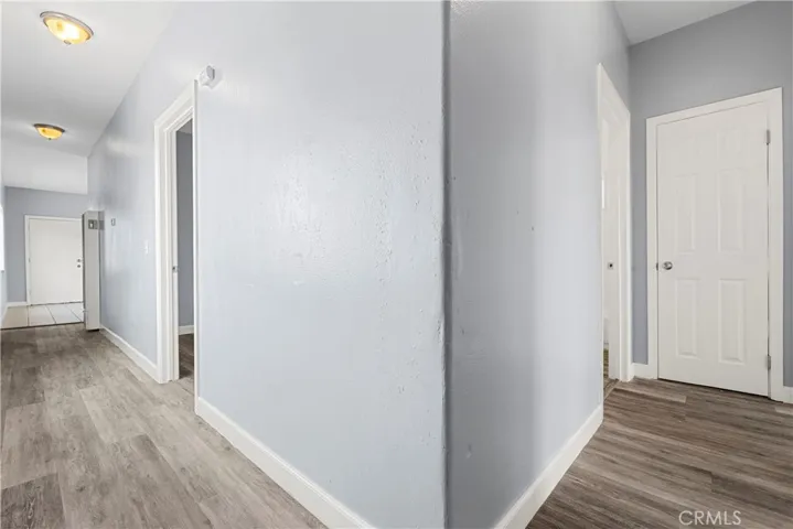 Upper Hall Corner.  The Stacked Laundry Closet is on the Right and the Bathroom Door is Just To The Left of That
