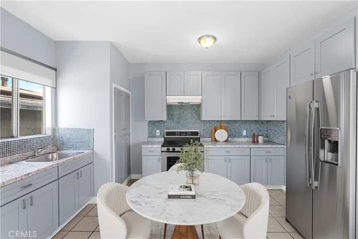 Kitchen Upper Unit with Small Dining Set - Virtually Staged and Enhanced.