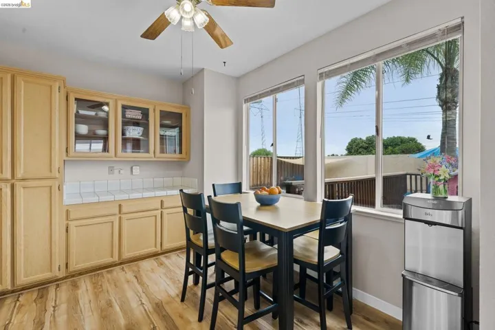 Dining area featuring light wood-style flooring and a ceiling fan