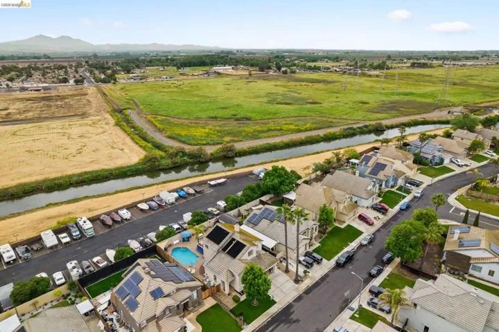 Aerial view of residential area with a nearby body of water