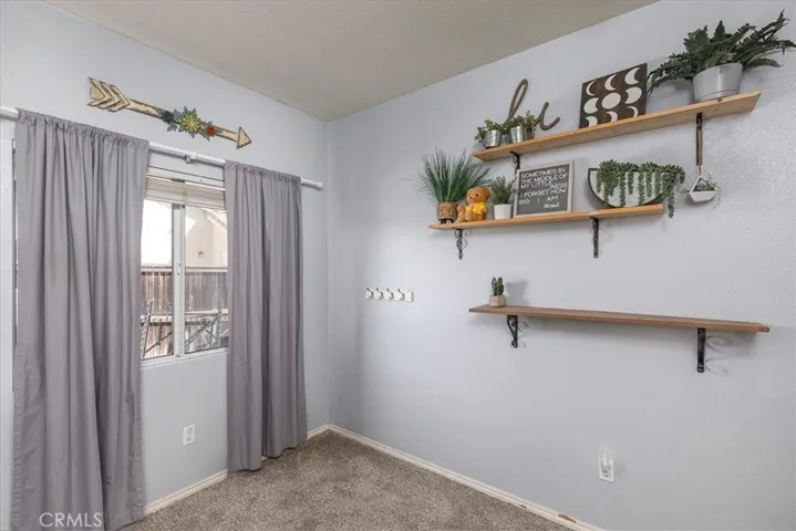 Portion of bedroom.