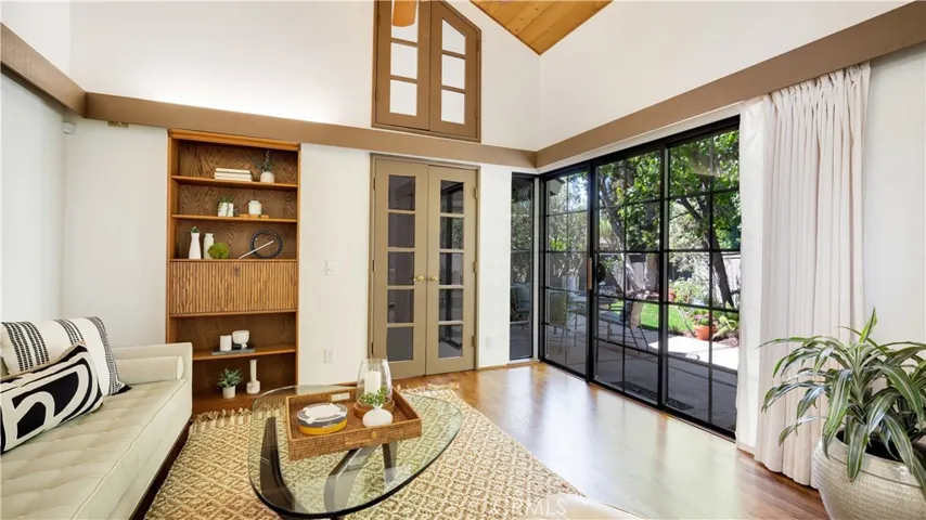 Real hardwood floors!- there are 3 sets of sliding glass doors with garden views!