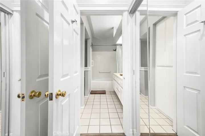 Double the space! Closets on both sides with full mirror doors.