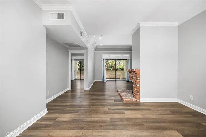 Neutral color palette compliments the rich laminate flooring.