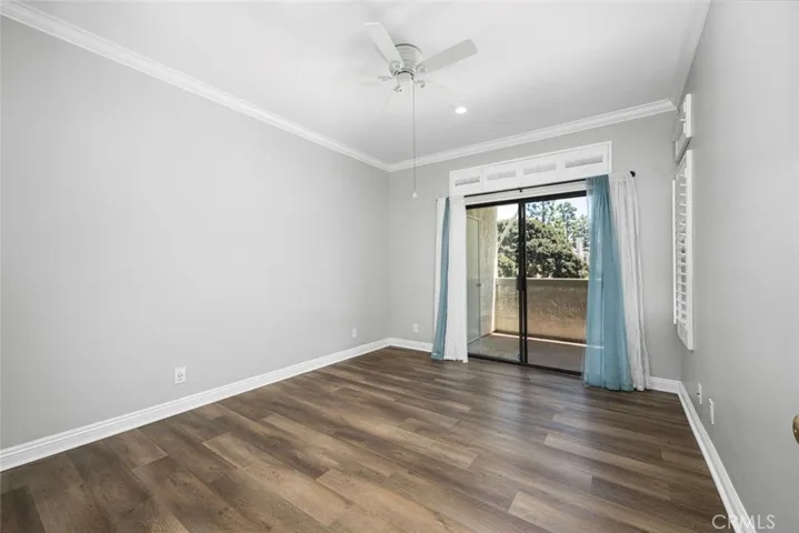 Spacious bedroom that opens to the balcony.