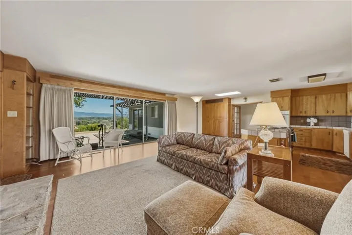 Glass doors leading to concrete patio off of family room.
