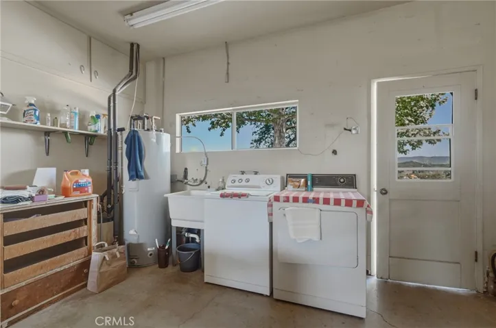 Solar water heater and laundry area in garage.