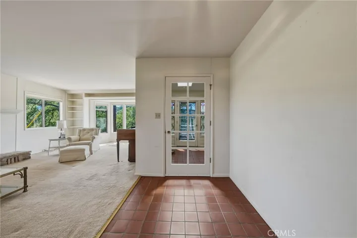 Entry to sun room with tile floors